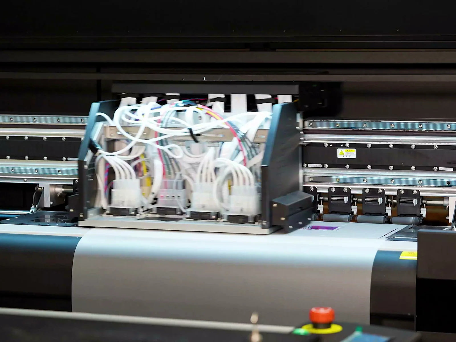 Wide-format DTF printer with its print carriage and film feed