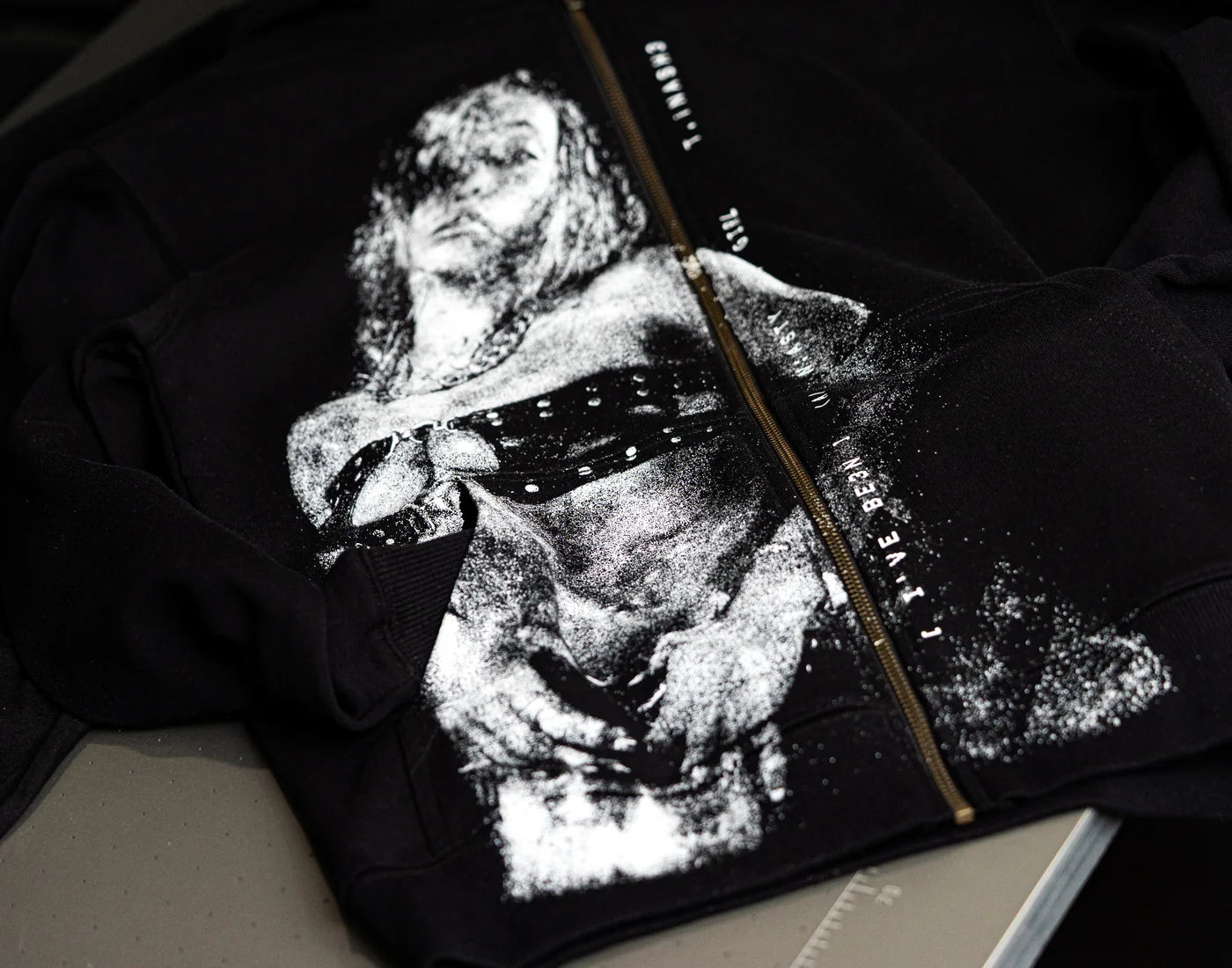 A finished print on a black garment checked after pressing