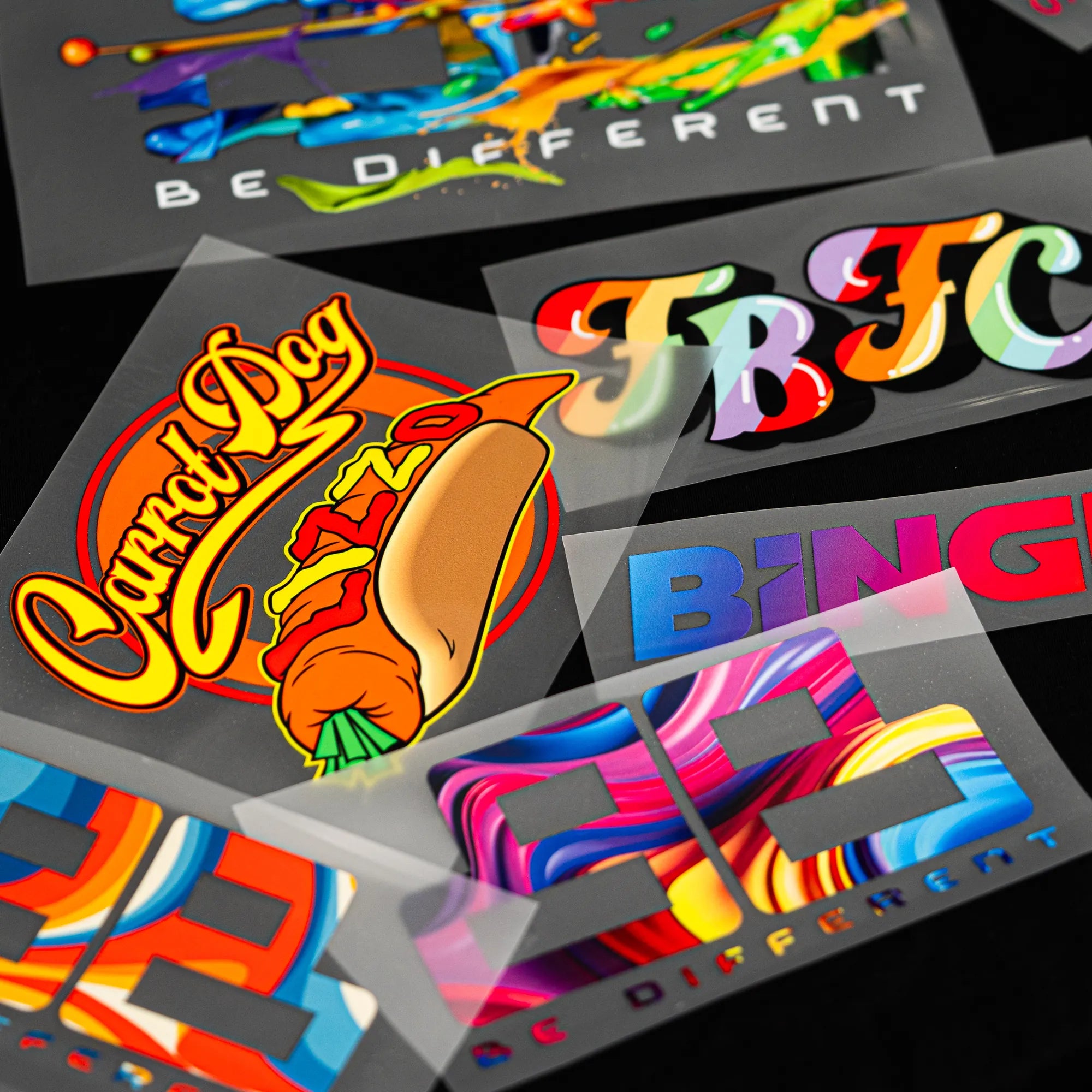 Multiple colourful artworks printed together on DTF transfer film